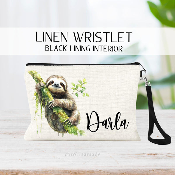 This linen zipper pouch features a watercolor sloth and is personalized with your name next to it. Perfect for travel, makeup, pens and more!