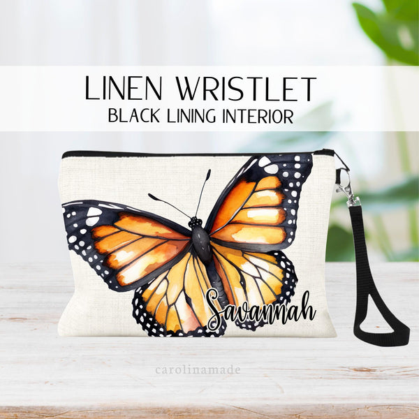 This linen zipper pouch features a large Monarch butterfly covering the majority of the bag and is personalized with your name in the bottom corner.