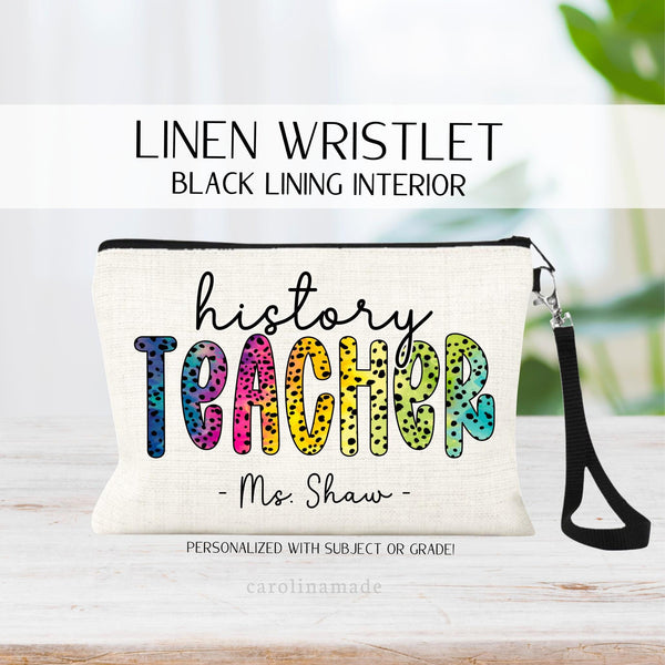 This linen zipper pouch has teacher in the center in bright colorful rainbow dalmatian pokadot design. It is personalized at the top with the teachers subject or grade. And the bottom is customized with their name.