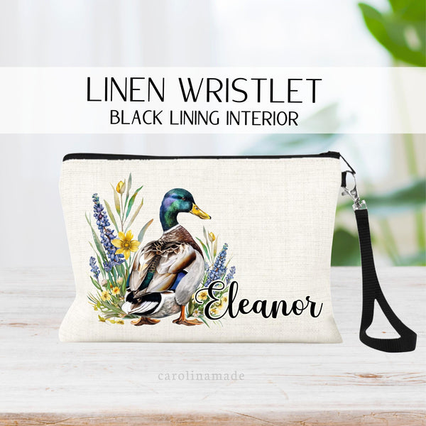 This linen zipper pouch features a watercolor floral mallard duck with greenery and is personalized with your name next to it. Perfect for travel, makeup, pens and more!