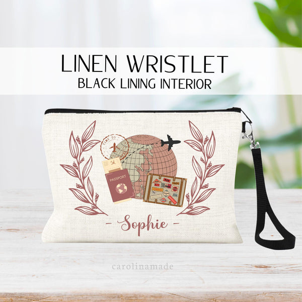 Personalized travel document zipper pouch. Design features globe with airplane, passport and suitcase with greenery on both sides. Personalize with name on the bottom