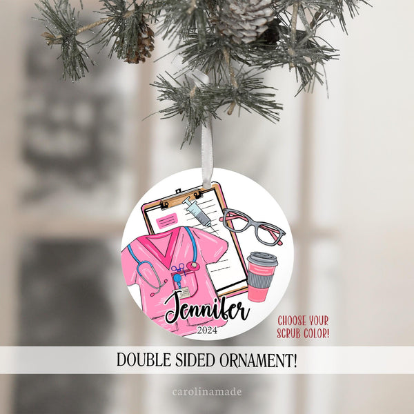 This Christmas ornament features a white background and has nurse clipart - clipboard, glasses, coffee, needle and scrubs with stethoscope. Choose your scrub color and personalize with name and year.