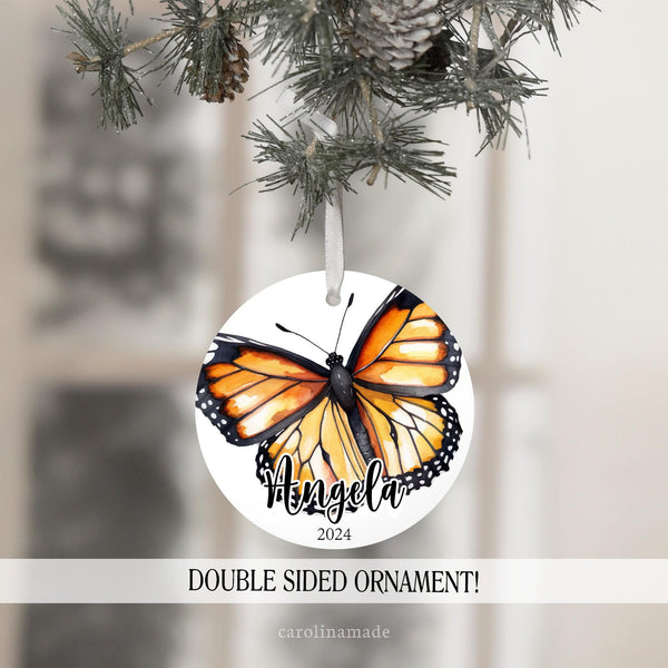This christmas ornament features a large monarch butterfly and is personalized with your name and the year.