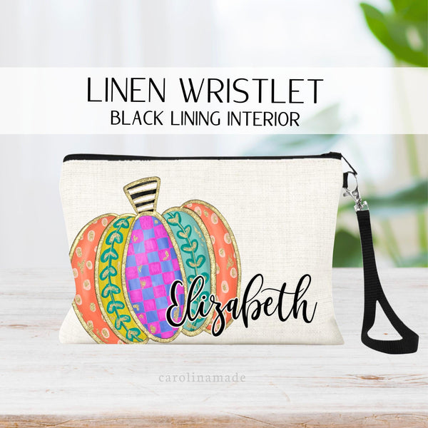 This linen zipper pouch features a fall colorful pumpkin design and is personalized with your name.