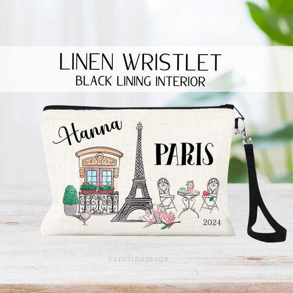 This linen wristlet is the perfect Paris accessory! It features Paris theme clip art - a town home, the Eiffel tower, a little bistro table with croissant roll, macaroons, and coffee. Also a Pigeon and rose clip art. Personalize with your name!