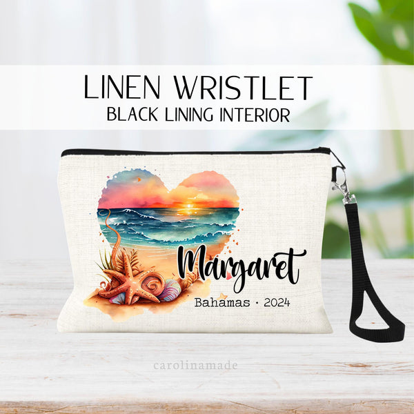 Watercolor beach scene in shape of a heart with sunset sky, ocean waves, sand and sea shells. Personalize with your name, the location & year. Or edit the text to fit your needs. Perfect for your next beach vacation, cruise, or girls trip.