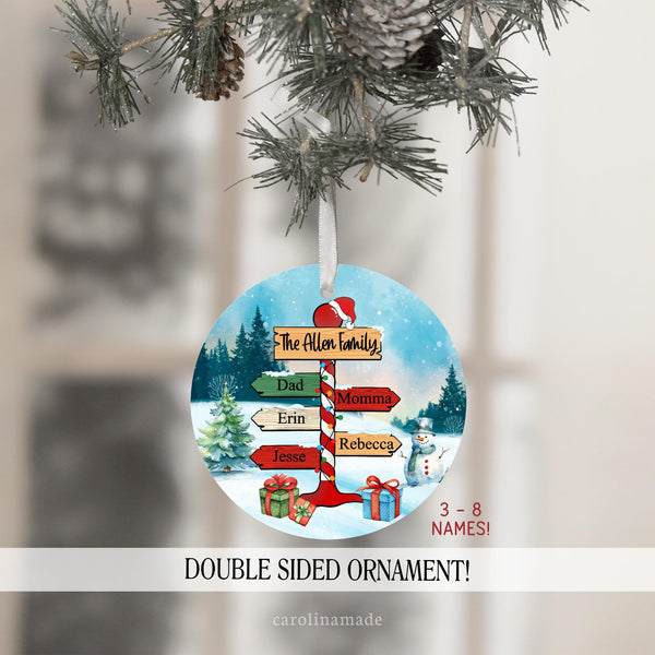 This metal ornament features a north pole sign with family name at the top and kids and parents name on the street sign.