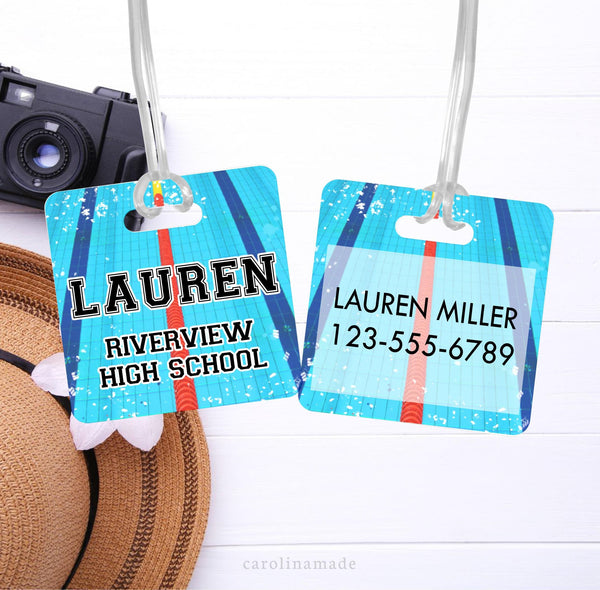 This personalized metal bag tag features a swimming pool background with your swimmers name on the front along with the name of their school or swim team. The back is customized with your contact information. Name, phone number, email, address, etc.