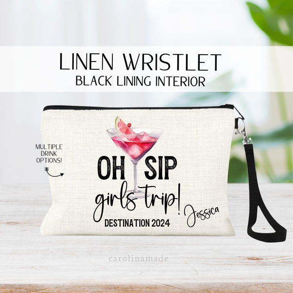 This linen zipper pouch with black strap features the text Oh Sip girls trip! With the destination and current year. Personalize with your name in the corner. There is a large alcoholic drink in the background that you get to choose!