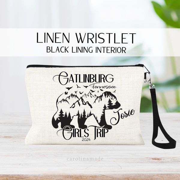 This linen zipper pouch features a bear, mountains and the text Gatlinburg Tennessee Girls Trip. It is personalized with your name and the year.