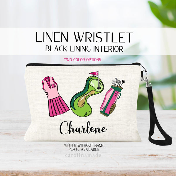 This linen zipper pouch features a soft black lining on the inside with black zipper and black wristlet strap. The front has a fun girly golf  bag, Pink Dress, grass and a hole marker. It is personalized with name at the bottom. Yellow & Green also!