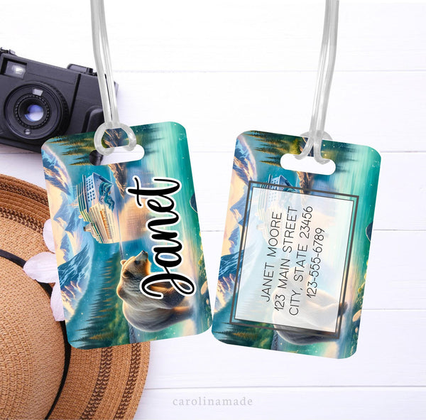 This metal bag tag shows a watercolor picture of Alaska mountains, bear and cruise ship. It is personalized with your name and contact information.