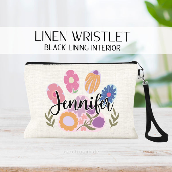 This linen zipper pouch features a paw print with flowers inside. It is personalized over top with your name. perfect for any veterinarian office worker. Receptionist, vet tech, assistant, kennel, customer service, and more
