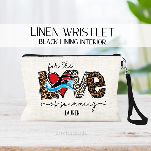 This linen zipper pouch features a swimming design that says for the love of swimming with a heart and swimmer as the O in LOVE. It is personalized at the bottom with a name.
