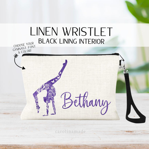 This linen zipper pouch features a colorful floral gymnast in your choice of position. And is personalized with gymnasts name.