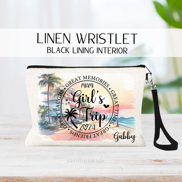 This linen zipper pouch features a Miami theme background with girls trip over it and is personalized with the year and name.