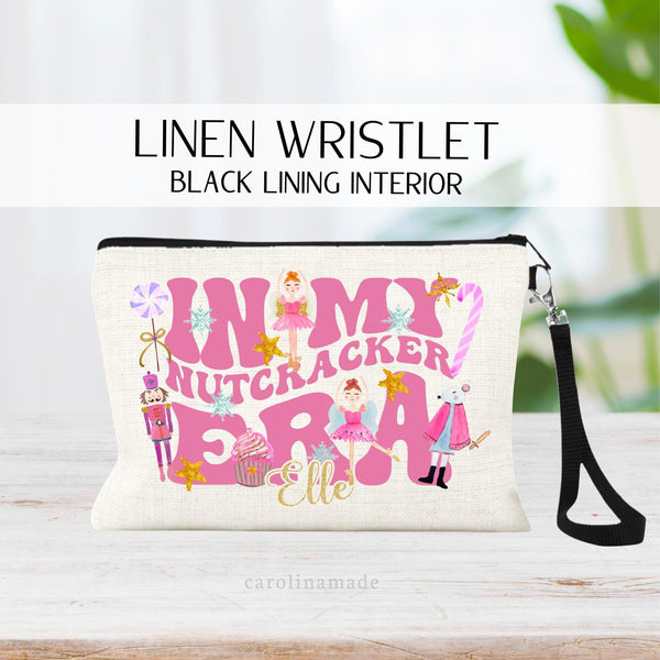 This linen zipper pouch features large text that says: In my Nutcracker era with various nutcracker characters and art around the text. The bottom is personalized with your name.