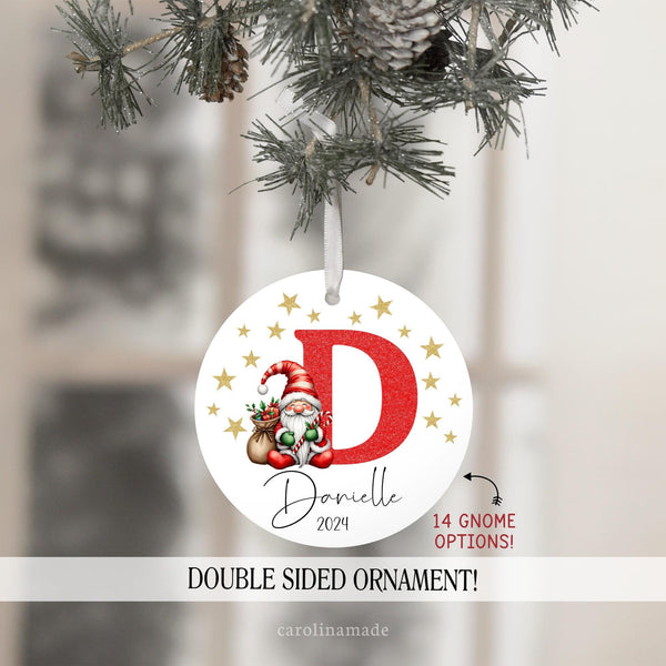 Custom gnome initial ornament with your choice of Christmas gnome. Initial is in red glitter design with gold stars surrounding. Your name is personalized at the bottom with year.