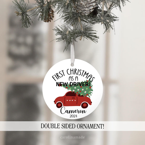 First Christmas as a new driver Christmas ornament. White background with black text. A red car with a Christmas tree on top. The bottom is personalized with your teens name and the year.