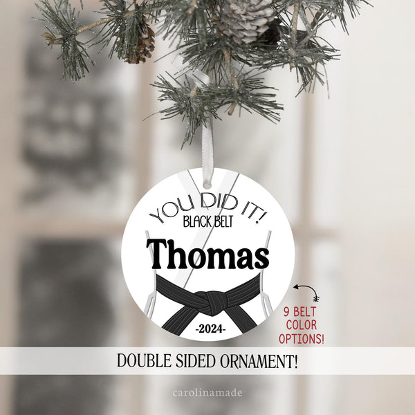 This ornament features a Karate Gi with your choice of belt color. The text says YOU DID IT at the top and is personalized with your name and the year.