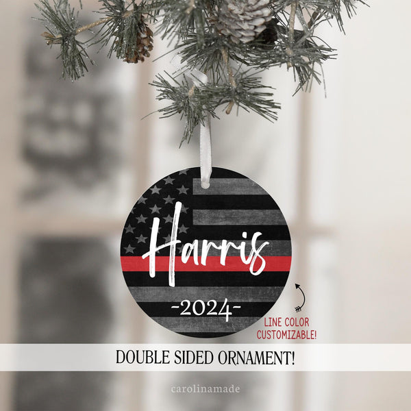 This ornament has a distressed flag background with a thin red line across it. It is personalized in the center with your family name and has the year at the bottom.