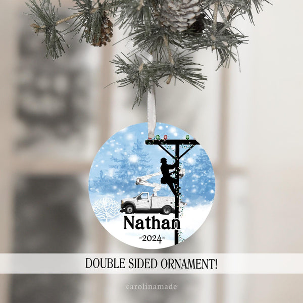This beautiful ornament features a snowy outdoor scene with a lineman climbing an electric pole. This personalized lineworker ornament is personalized at the bottom with name and year.