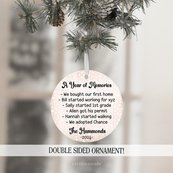 This ornament says A Year of Memories at the top and then lists all the familys accomplishments for the year. The bottom is personalized with your family name and the year.
