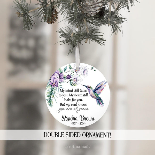 This ornament features beautiful watercolor purple flowers and and hummingbird with a memorial quote. It is personalized at the bottom with a name and the years of their life.