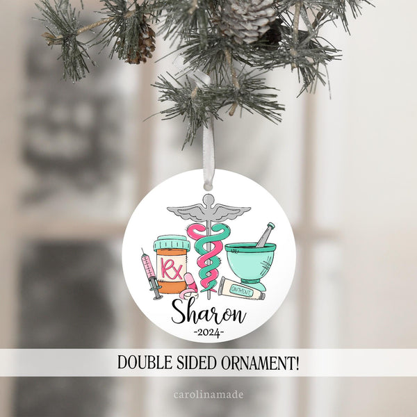 The perfect ornament for your favorite pharmacist! This Christmas ornament features pharmacy things like an RX bottle, medicines, ointment, etc. It is personalized with your name and the year.