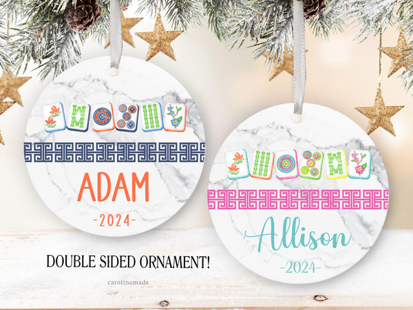 Mahjong Christmas Ornaments feature a marble background, your choice of mahjong tile colors, a Chinese border and is personalized at the bottom with your name and the year.