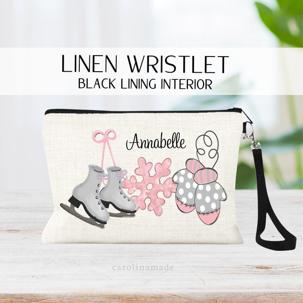 This linen zipper pouch features a watercolor design of ice skates, pink snow flake and mittens. It is personalized with your name at the top.