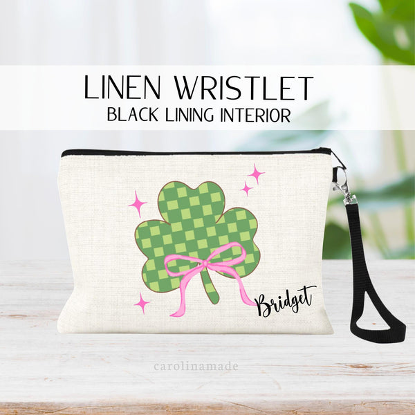 This linen zipper pouch features a checkered st patricks day clover with pink bow and pink sparkles. It is personalized with your name on the bottom corner.