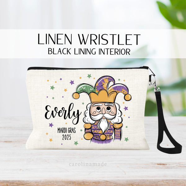 This linen wristlet features a Nutcracker with stars all around in mardi gras colors of purple, green and yellow. It is personalized with your name and the year. Perfect girls trip zipper pouch!