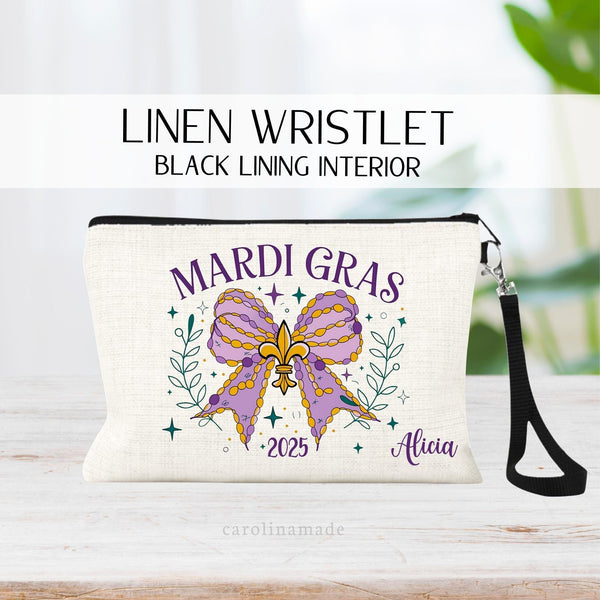 This linen wristlet features a large Bow with stars and leaves all around in mardi gras colors of purple, green and yellow. It is personalized with your name and the year. Perfect girls trip zipper pouch!
