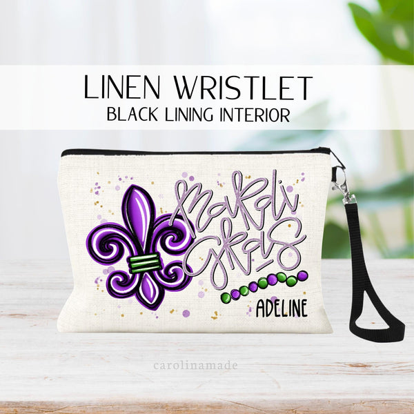 This linen wristlet features a large purple mardi gras fleur de lis and beads in purple and green. It is personalized with your name in the corner. Perfect girls trip zipper pouch!