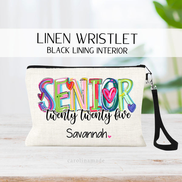 This zipper pouch features SENIOR in big colorful letters and the year spelled out under it, twenty twenty five. It is personalized at the bottom with a name. Perfect gift for Class of 2025