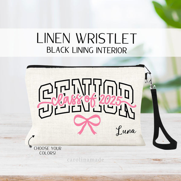 This linen zipper pouch features the word SENIOR large across the bag with class of 2025 written on it. There is a pink bow under the text. Your name is personalized in the corner. Customize the text colors to fit your childs school or personality.