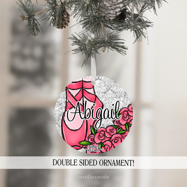 This Christmas ornament features ballet slippers and pink roses. It is personalized in the center with your ballerinas name and the year at the bottom.