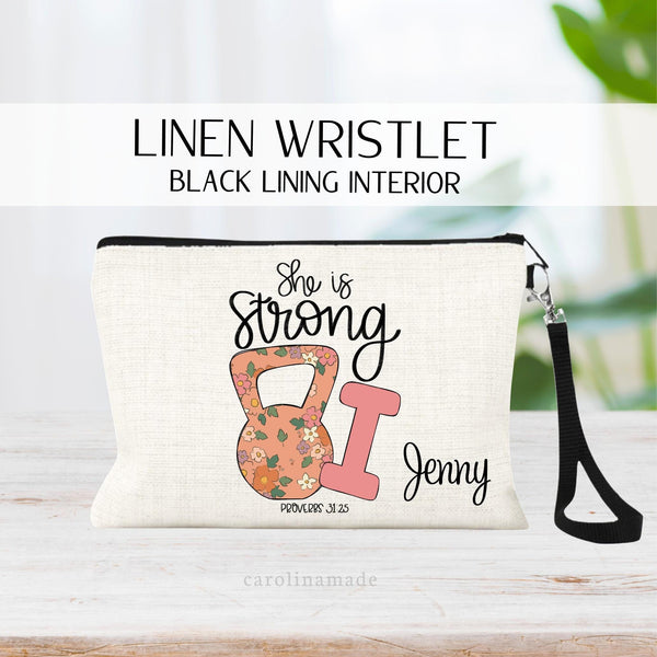 This linen zipper pouch gym bag features floral kettle bell and pink hand weigh with the bible verse She is Strong Proverbs 31 25  Personalized with your name.