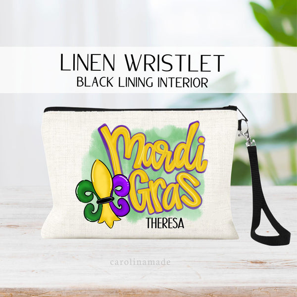 This linen zipper pouch is the perfect accessory for your trip to Mardi Gras! It features a mardi gras in yellow, green and purple colors.. It is personalized with your name on the bottom.