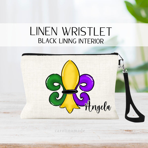 This linen zipper pouch is the perfect accessory for your trip to Mardi Gras! It features a mardi gras symbol in yellow, green and purple colors.. It is personalized with your name on the bottom.