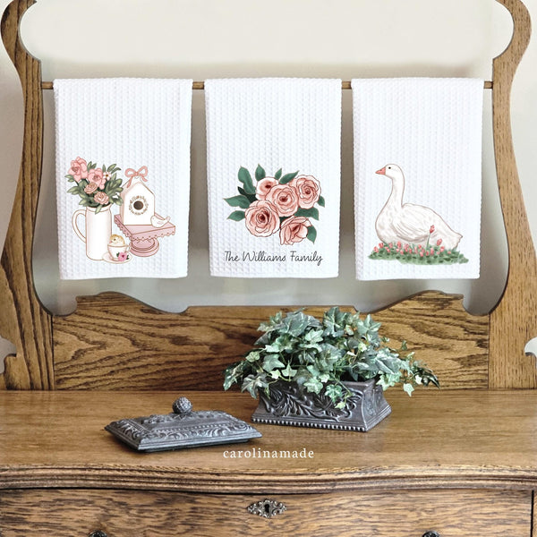 This linen white waffle weave towel set features three spring decor towels. One with roses, bird house and baby chick. The second with roses and your personalized family name. Third has a white duck and flowers.