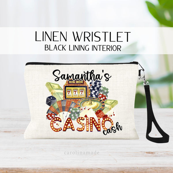 Dont forget your wristlet purse your next casino trip! This bag features casino items combined to one design. And is personalized with your name. persons Casino Cash!  Dice, poker chips, cash, slot machine, roulette and more
