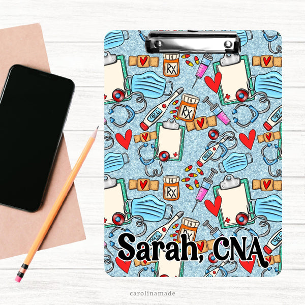 This double sided clipboard features a blue printed glitter background with medical elements all over.  Rx Bottle, pills, needle, stethoscope, thermometer, mask, etc. Personalize with any medical workers name.