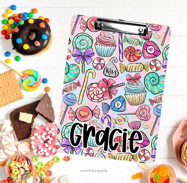 This double sided clipboard features a fun candy and cupcake design with pink and blue watercolor background. And it is personalized with your name.