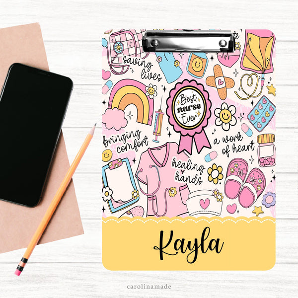 This double sided clipboard features a pink and yellow groovy nurse design with nursing elements like bandages, blood pressure cuff, needle, stethoscope and more! It is personalized at the bottom with your favorite nurses name.