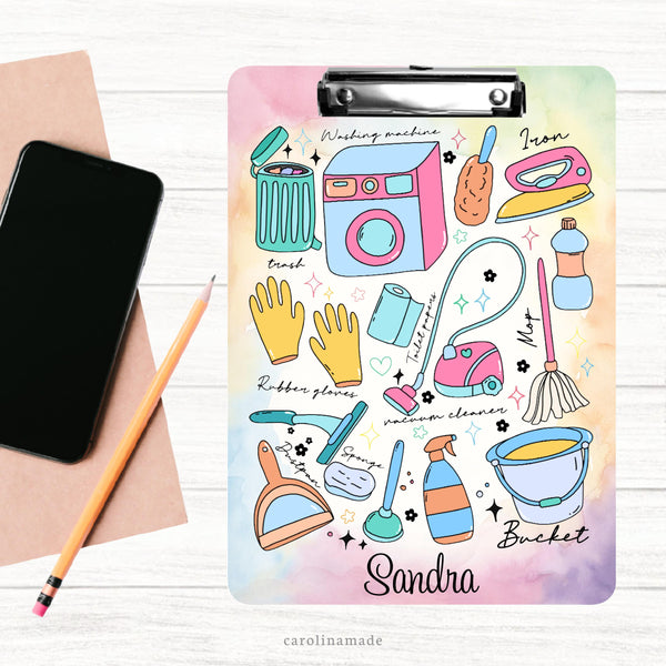 This double sided clipboard features a colorful watercolor background with cleaning clipboard all over. Trash, washing machine, iron,gloves, cleaning spray, mop etc. The clipboard is personalized at the bottom with a name.