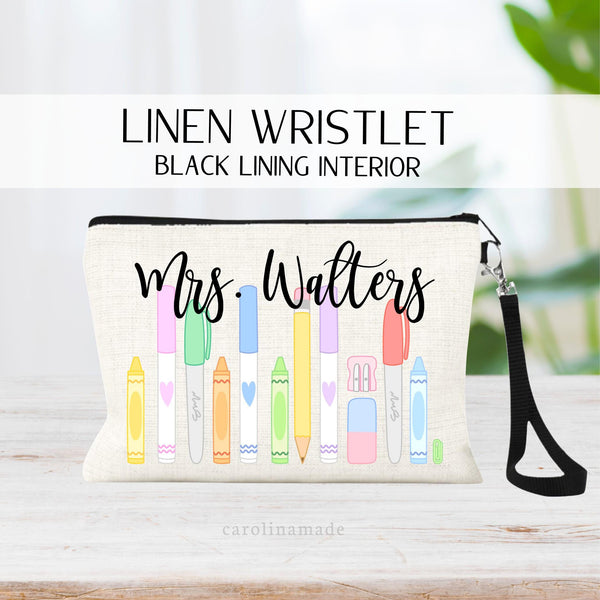 This linen zipper pouch is perfect gift idea for your childs teacher.It features a row of pastel crayons, markers, pencil and supplies. It is personalized at the top with teachers name.