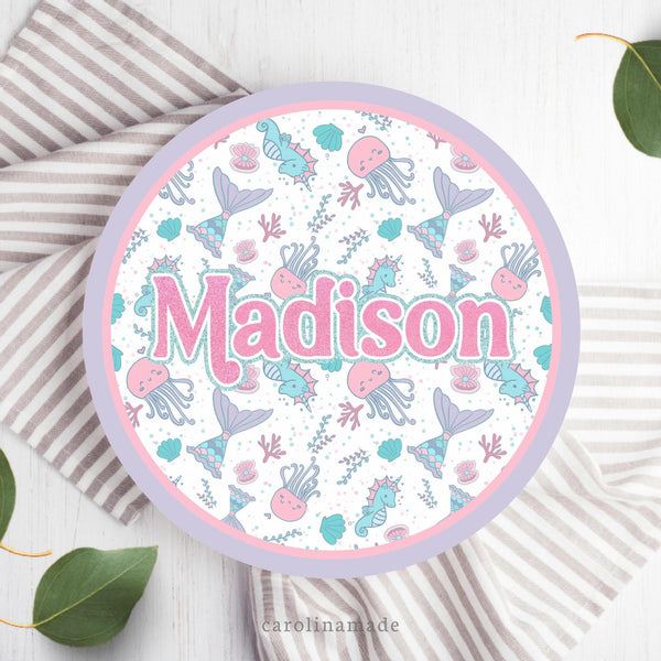 This 10 inch plate features a pink, purple and teal mermaid theme. with mermaid, jelly fish, sea horses, clams and reef in the center. A purple and pink outer ring. And your childs name personalized in the center.