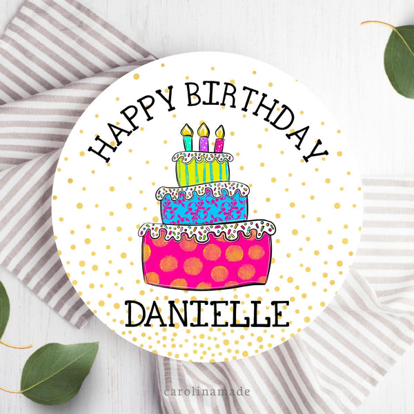 This ten inch birthday cake plate features a gold confetti background and the top says Happy Birthday around the top with a large colorful cake in the center. The bottom is personalized with a name.